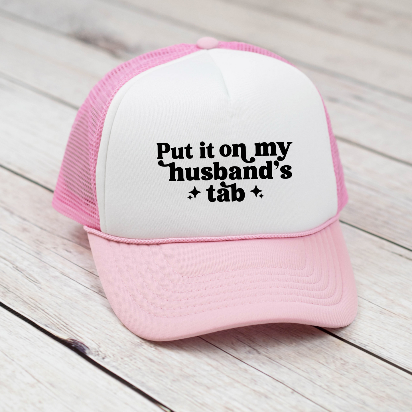 Put it on my husbands tab Trucker Hat